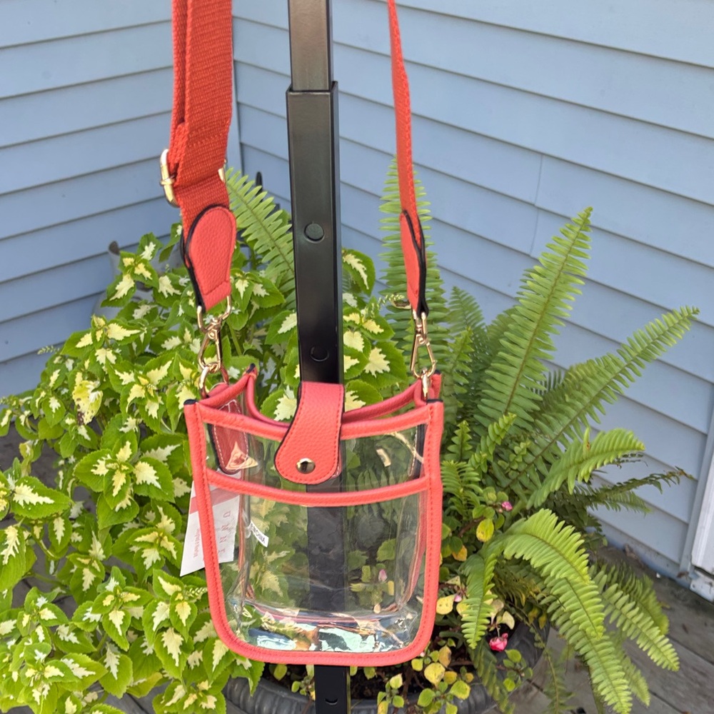 Clear Crossbody adjustable strap with coral accents.perfect for concerts & game